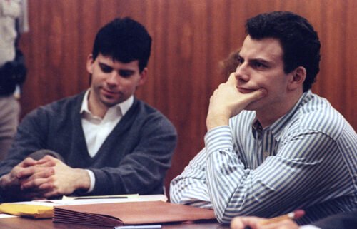 Erik Menendez (R) and his brother Lyle listen to court proceedings on May 17