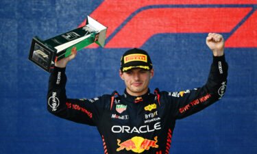 Max Verstappen celebrates on the podium after winning the Miami Grand Prix.