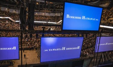 Attendees arrive at the auditorium of the CHI Health Center during the Berkshire Hathaway annual meeting in Omaha