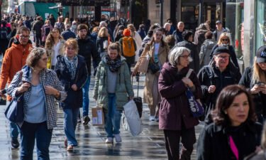 The United Kingdom's economy limped along in the first quarter of this year as consumers as high inflation hits spending. London shoppers here walk along Oxford Street on March 24.
