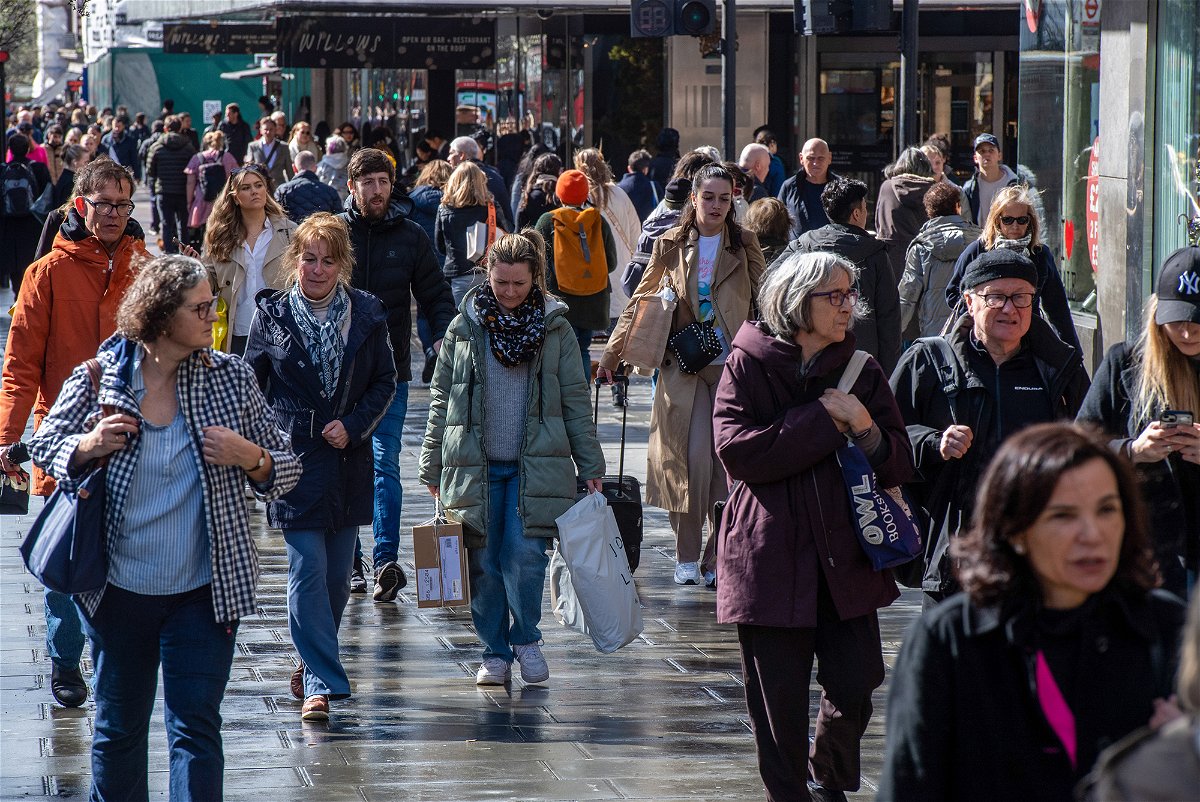 <i>Chris J. Ratcliffe/Bloomberg/Getty Images</i><br/>The United Kingdom's economy limped along in the first quarter of this year as consumers as high inflation hits spending. London shoppers here walk along Oxford Street on March 24.