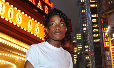 Jordan Neely stands in 2009 outside a Times Square cinema in New York.