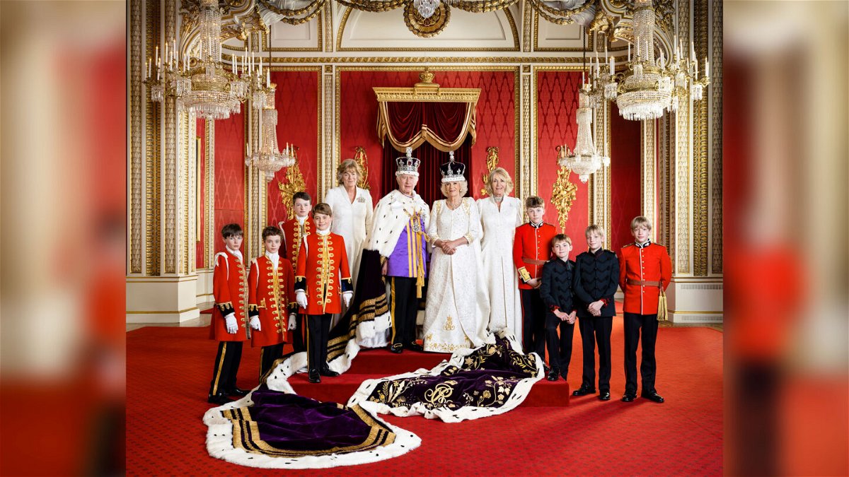 <i>Hugo Burnand/Royal Household 2023/AP</i><br/>In this photo released by Buckingham Palace on May 12 Britain's King Charles III and Queen Camilla pose for a photo with their Pages of Honour and Ladies in Attendance on the day of the coronation