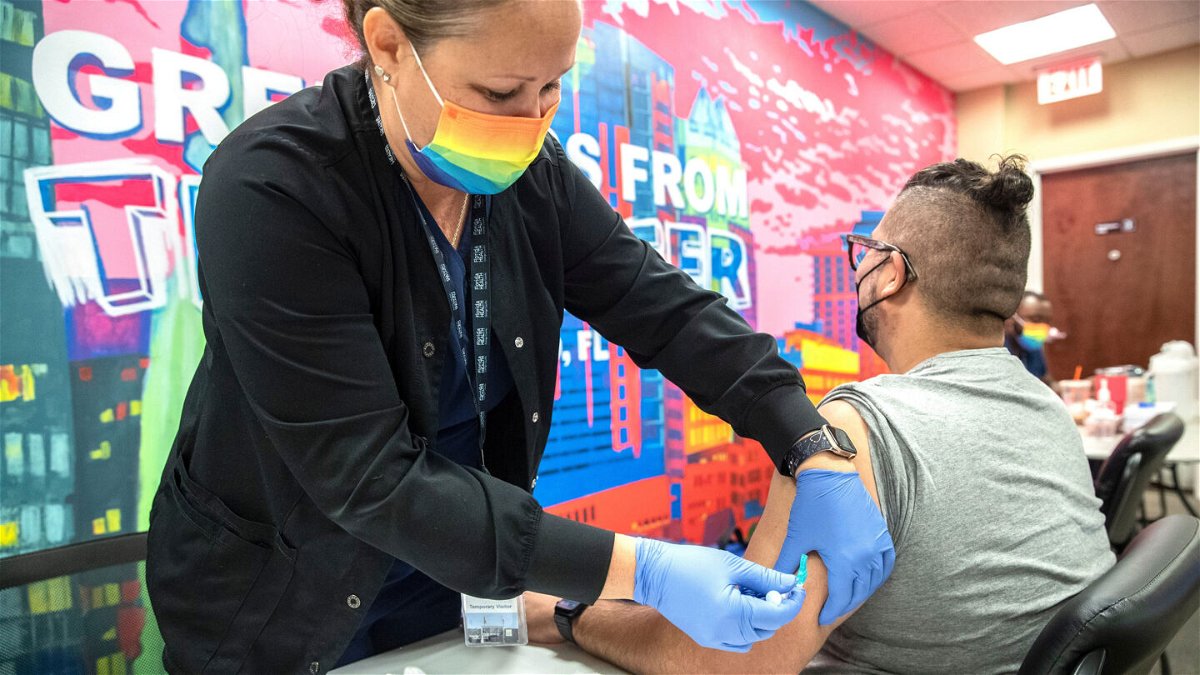 <i>Willie J. Allen Jr./Orlando Sentinel/Getty Images</i><br/>Nurse Kerri Phithibeault gives Danny Garcia an mpox vaccination in Orlando