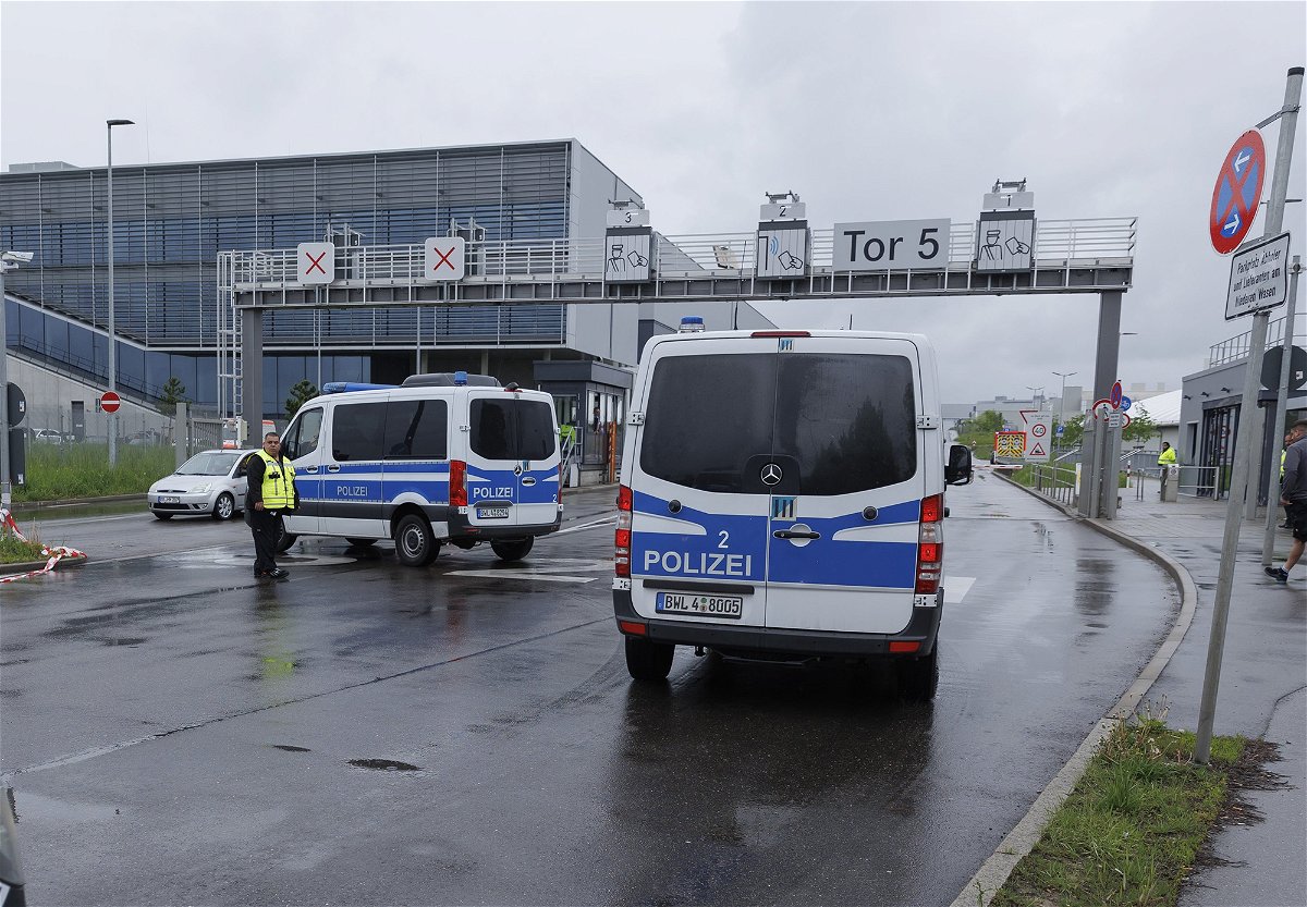 <i>Julian Rettig/AP</i><br/>Police vehicles pictured at a Mercedes-Benz plant in Sindelfingen