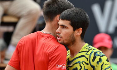 Marozsán and Alcaraz embrace after their match.