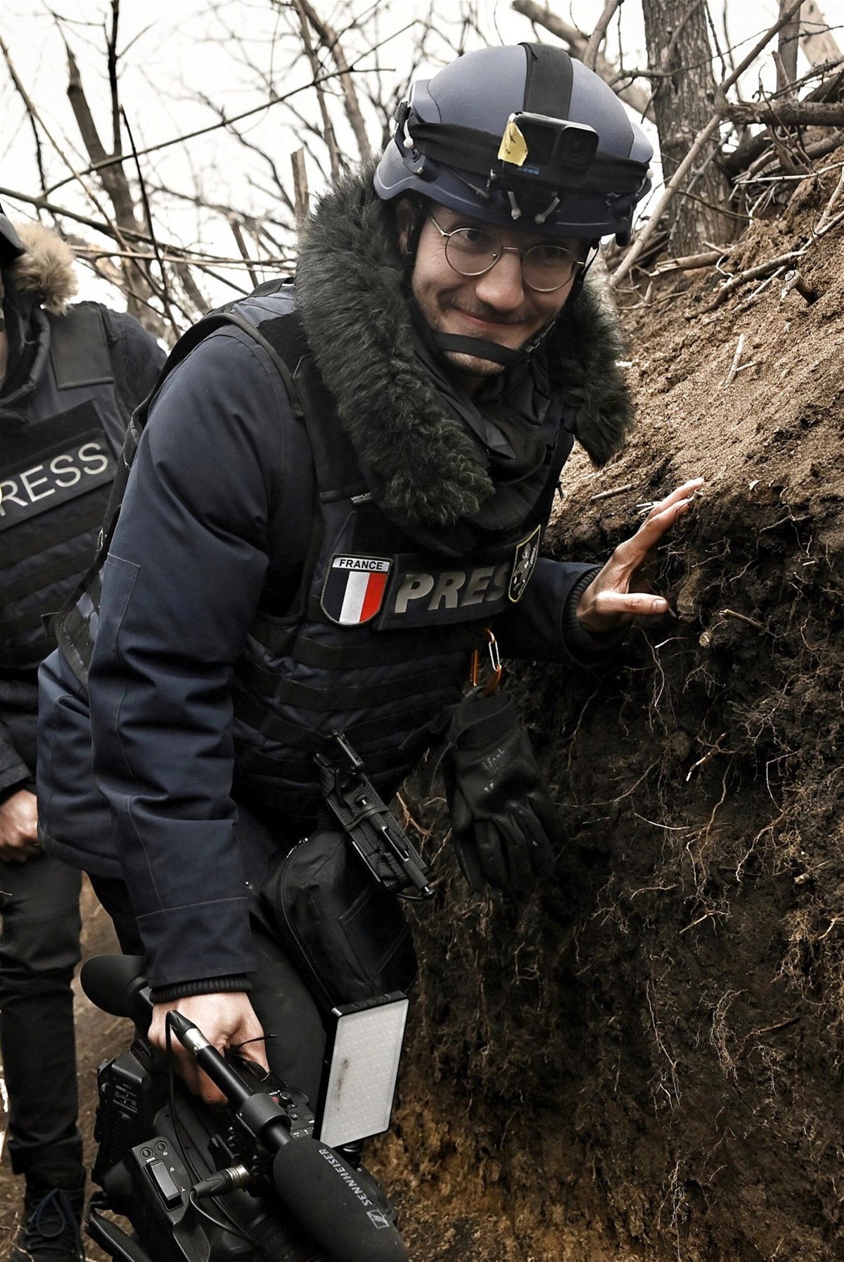 <i>Aris Messinis/AFP/Getty Images</i><br/>AFP journalist Arman Soldin in a trench while covering the war in Ukraine on March 18.