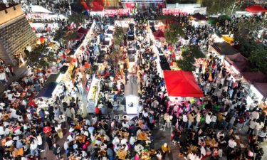 Tourists visit a night market in Liuzhou