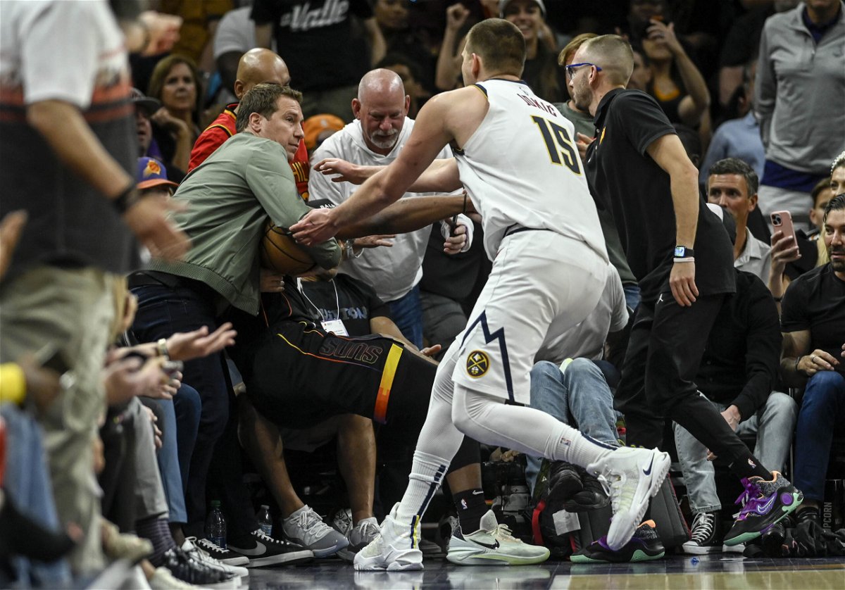 <i>AAron Ontiveroz/Denver Post/Getty Images</i><br/>Nikola Jokić wrestled with Phoenix Suns owner Mat Ishbia in Game 4 of the Western Conference semifinal.