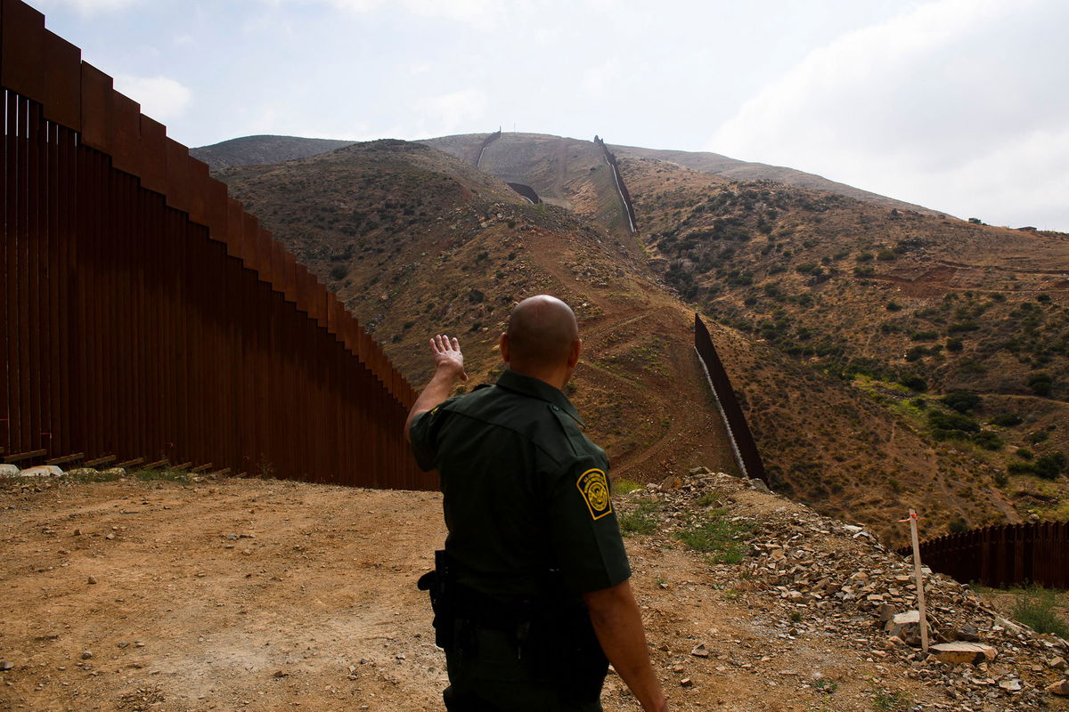 <i>Patrick T. Fallon/AFP/Getty Images</i><br/>The House will vote Thursday on a sweeping GOP border security bill. Pictured is a US Border Patrol agent in 2021 in San Diego County