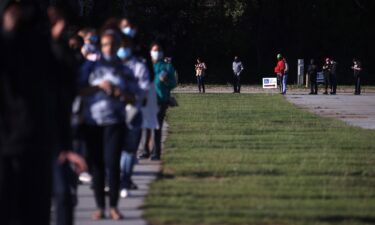 People line up to vote at the Gwinnett County Fairgrounds in October 2020 in Lawrenceville