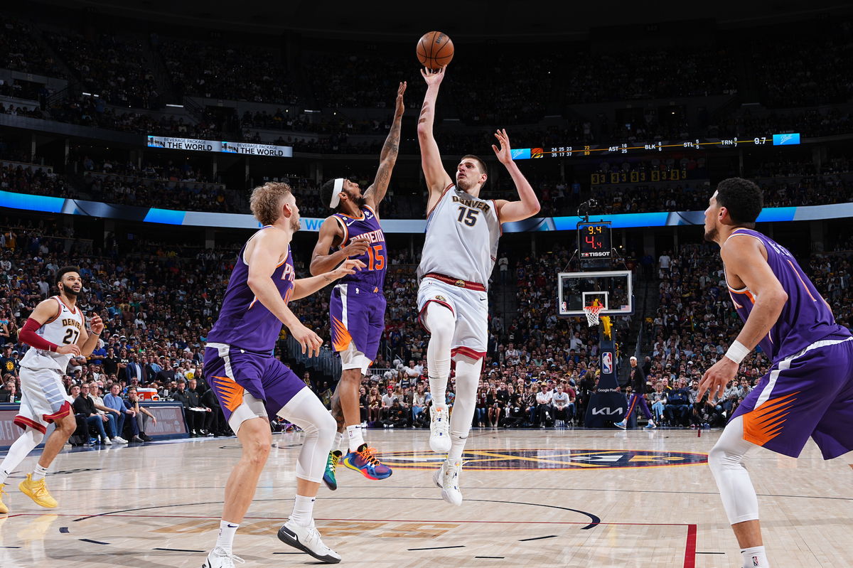 <i>Garrett Ellwood/NBAE/Getty Images</i><br/>Nikola Jokić shoots the ball against the Phoenix Suns during Game 5.