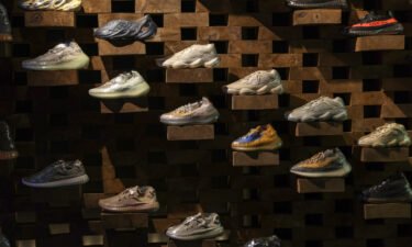 Adidas will sell Yeezy shoes after all. Pictured are Adidas 'Yeezy' shoes inside a London store in 2021.