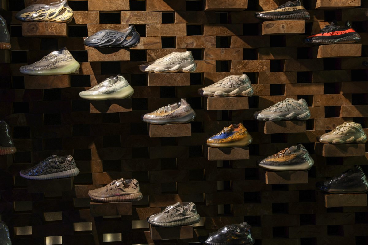 <i>Hollie Adams/Bloomberg/Getty Images</i><br/>Adidas will sell Yeezy shoes after all. Pictured are Adidas 'Yeezy' shoes inside a London store in 2021.
