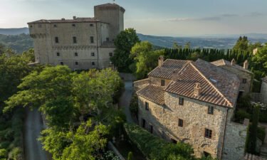 A South African couple bought a rundown castle on a Tuscany hilltop and turned the fortress into a luxury second home.
