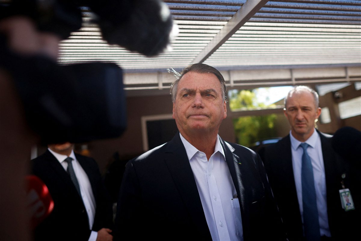 <i>Adriano Machado/Reuters</i><br/>Former Brazilian President Jair Bolsonaro leaves his home following a search operation in Brasilia on May 3.