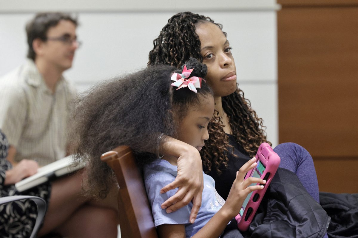 <i>Mike Stocker/South Florida Sun Sentinel/Tribune News Service/Getty Images</i><br/>Philana Holmes and her daughter Olivia Caraballo listen to the final witness in their case in Fort Lauderdale