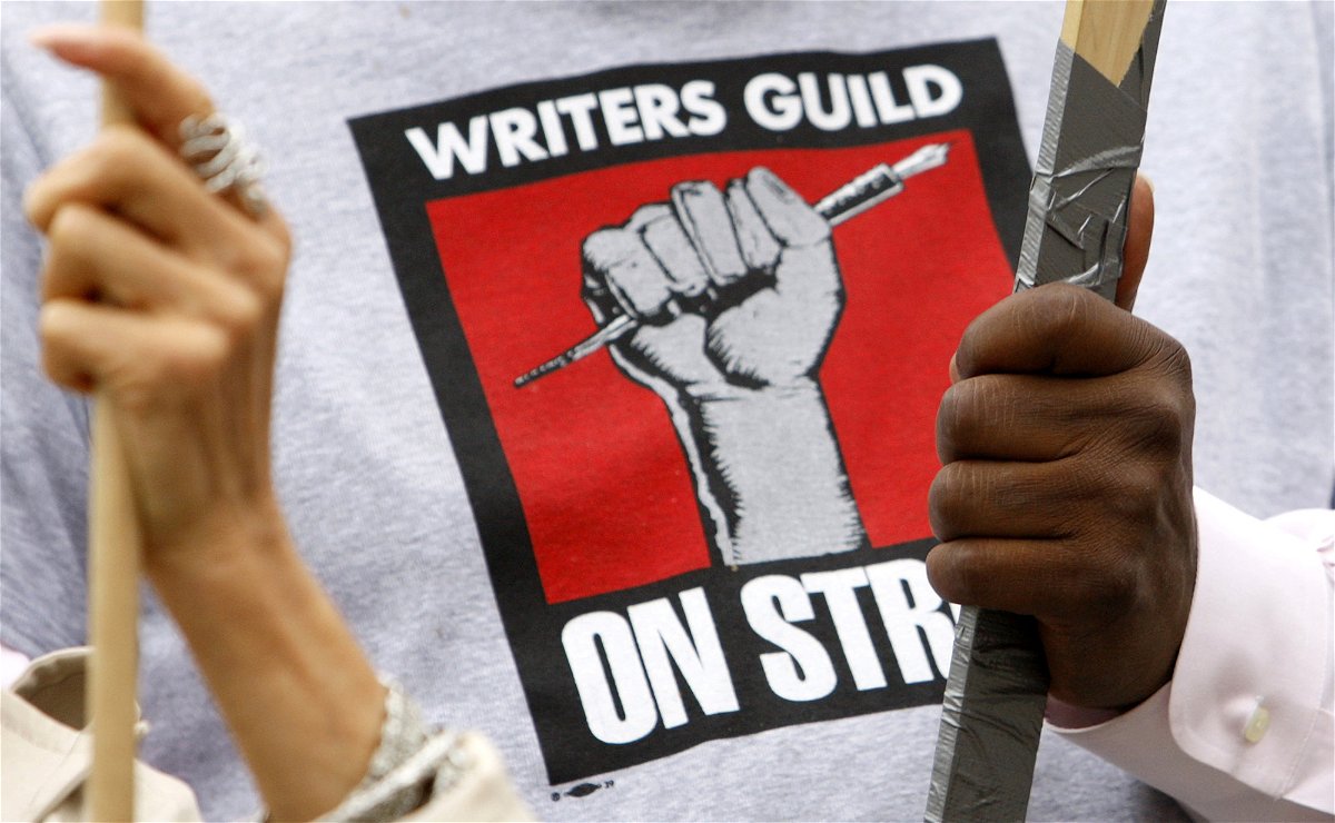 <i>Lucy Nicholson/Reuters</i><br/>Members of Writers Guild of America hold signs on a picket line in front of Paramount Studios during the 2007 strike that lasted 100 days.