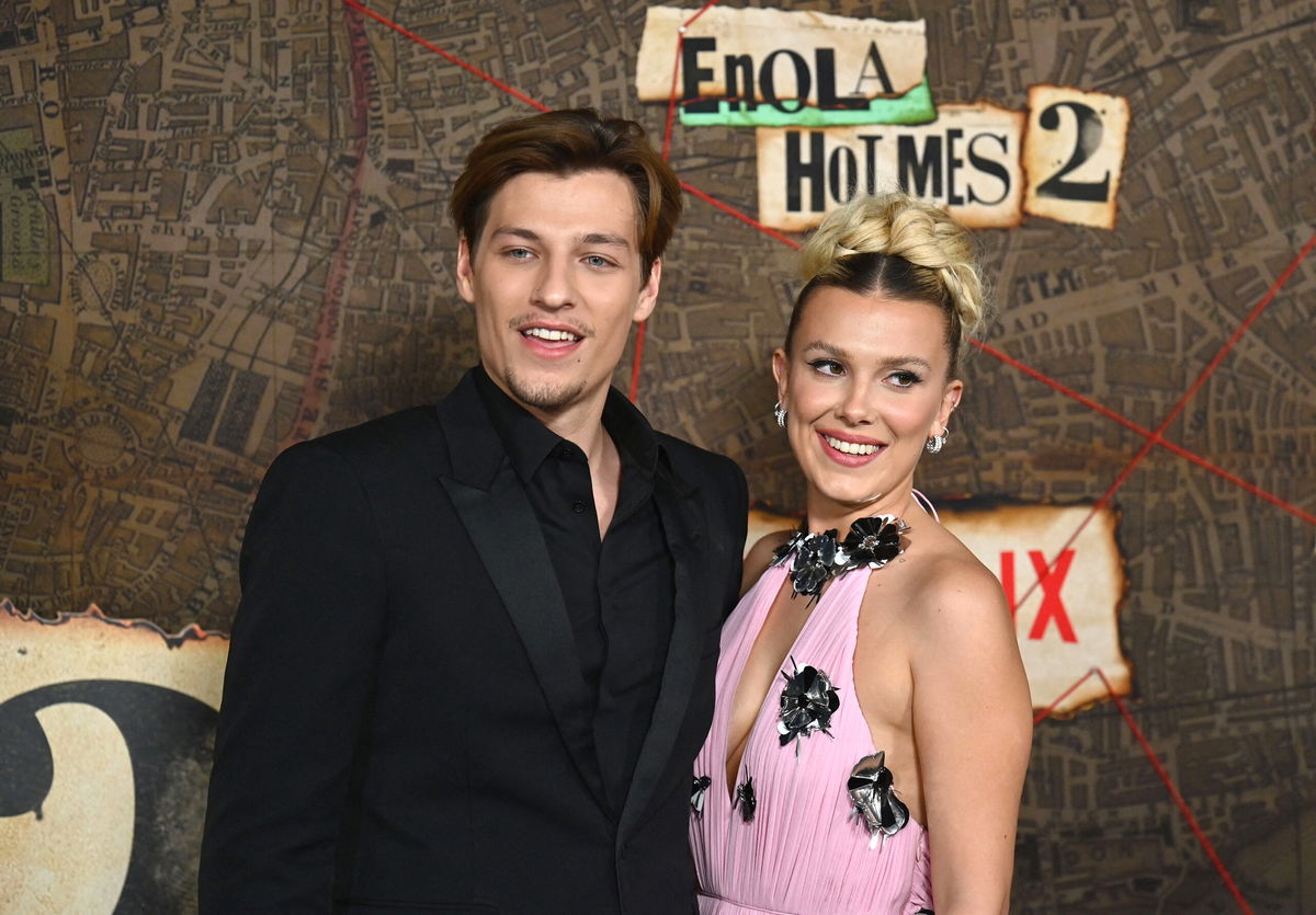 <i>Angela Weiss/AFP/Getty Images</i><br/>Jon Bon Jovi has no issue with his son Jake being engaged to Millie Bobby Brown. Jake Bongiovi (L) and actress Millie Bobby Brown are pictured here in 2022.