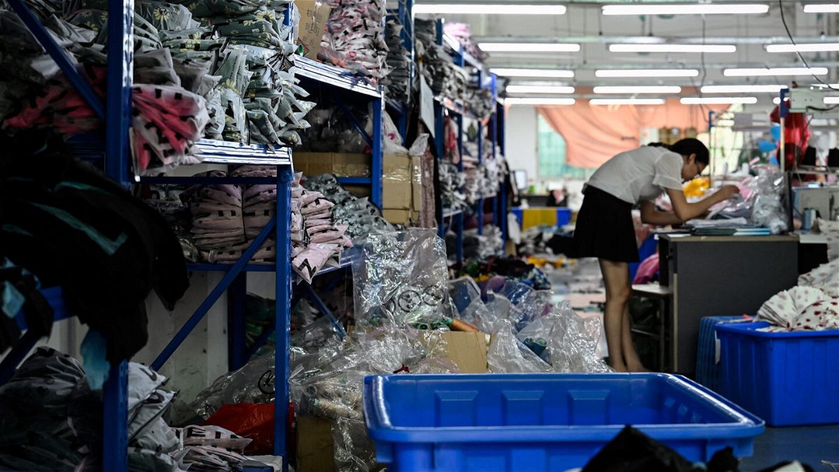 <i>Jade Gao/AFP/Getty Images</i><br/>A worker makes clothes at a garment factory that supplies Shein.