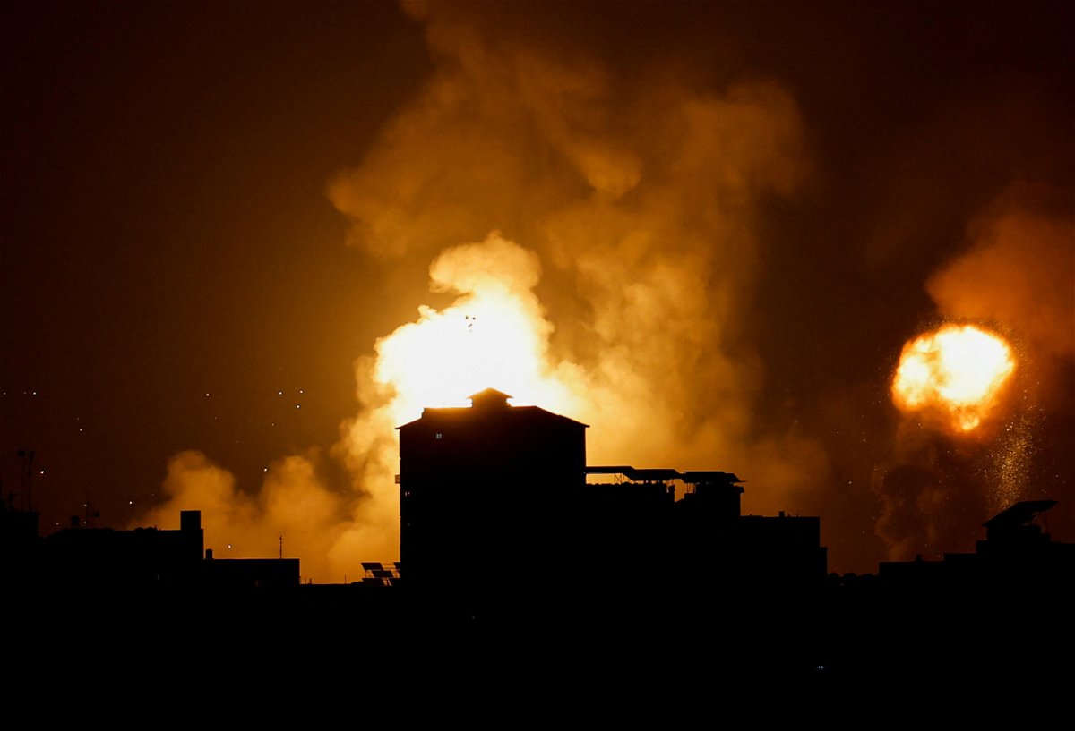 <i>Mohammed Salem/Reuters</i><br/>Smoke and flames rise into the sky after the Israeli military said in a statement that it has struck Islamic Jihad targets