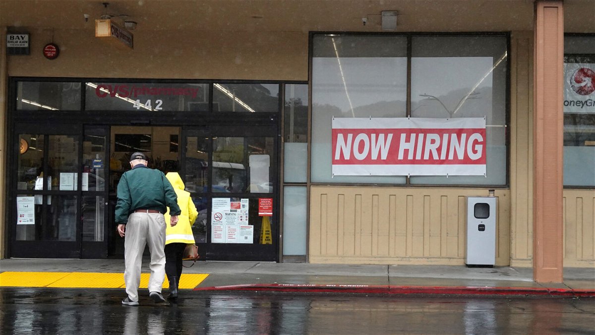 <i>Justin Sullivan/Getty Images</i><br/>The number of open jobs in the United States has dropped to the lowest level since May 2021. People walk by a now hiring sign posted in front of a CVS store on April 07