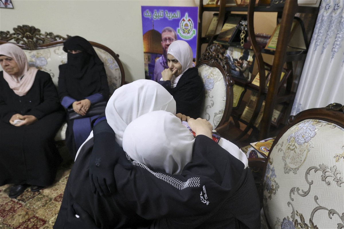 <i>Jaafar Ashtiyeh/AFP/Getty Images</i><br/>Relatives of Khader Adnan mourn after his death was announced