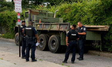 Police surround a privately-owned military vehicle in Baltimore after a suspect was taken into custody for allegedly stealing the 5-ton vehicle and leading officers on a highway chase.