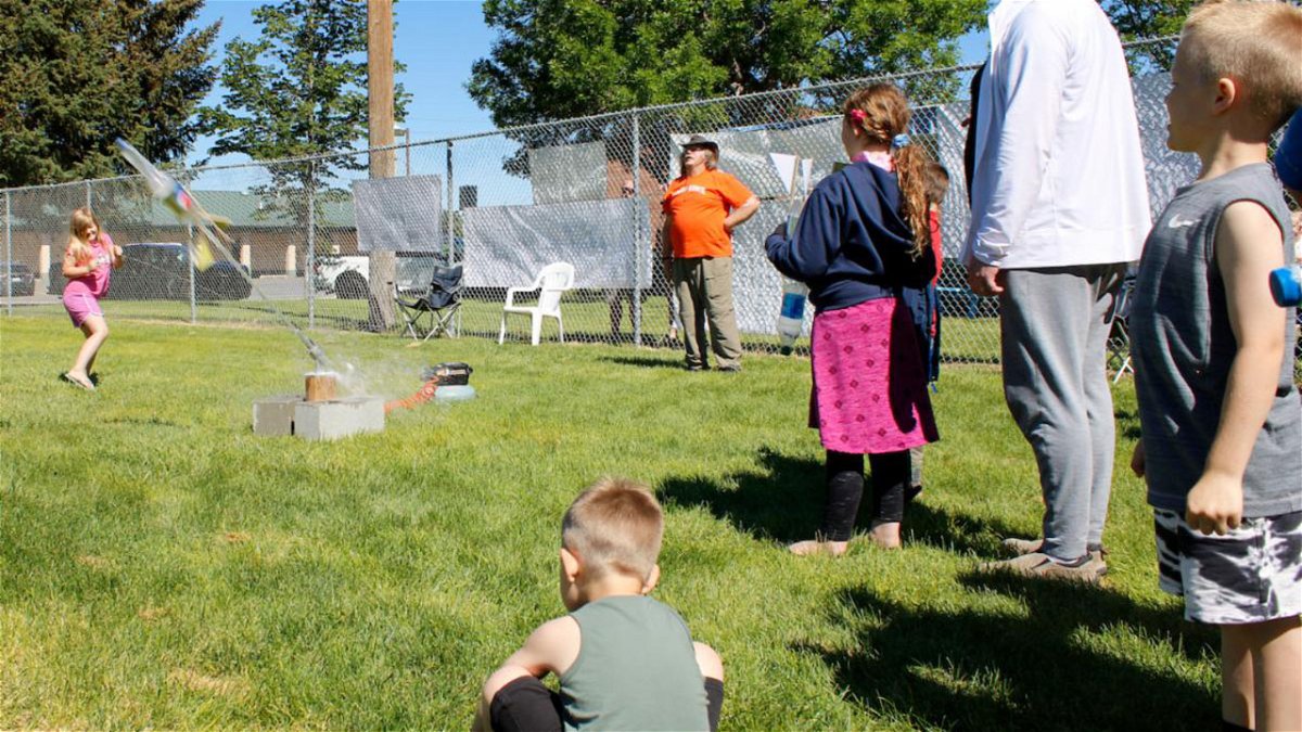 A participant launches their water rocket in front of onlookers at the 2022 Water Rocket Festival in Pocatello’s Tydeman Park.