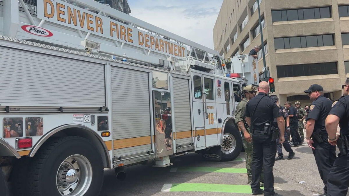 <i>KCNC</i><br/>Veteran SWAT police officer Sgt. Justin Dodge was at Denver Health late Thursday for a serious leg injury after getting trapped under the wheel of a Denver fire truck during the Denver Nuggets parade earlier in the day.