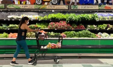 A customer shops for produce at a Cardenas Market on June 8