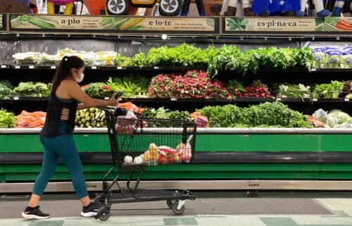 A customer shops for produce at a Cardenas Market on June 8