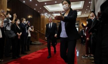 U.S. Secretary of State Antony Blinken walks as he arrives to meet with China's Director of the Office of the Central Foreign Affairs Commission Wang Yi (not pictured) at the Diaoyutai State Guesthouse in Beijing
