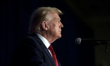 Former President Donald Trump takes the stage to address a Republican women's luncheon in Concord