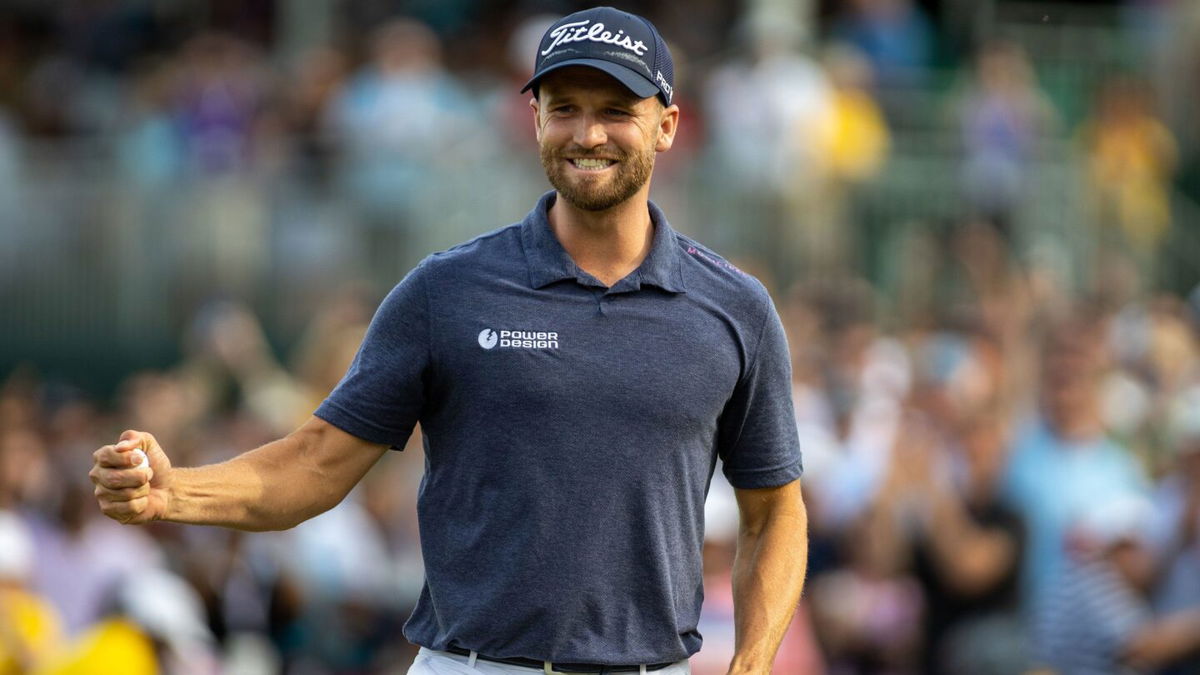 <i>Eston Parker/ISI Photos/Getty Images</i><br/>Wyndham Clark immediately celebrates after making his final putt on the 18th hole during the Final Round at the Wells Fargo Championship at Quail Hollow Golf Club on May 7 in Charlotte