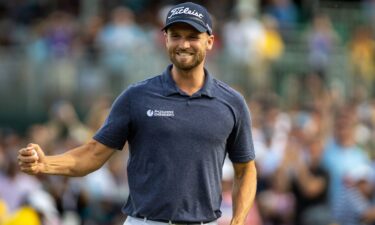 Wyndham Clark immediately celebrates after making his final putt on the 18th hole during the Final Round at the Wells Fargo Championship at Quail Hollow Golf Club on May 7 in Charlotte