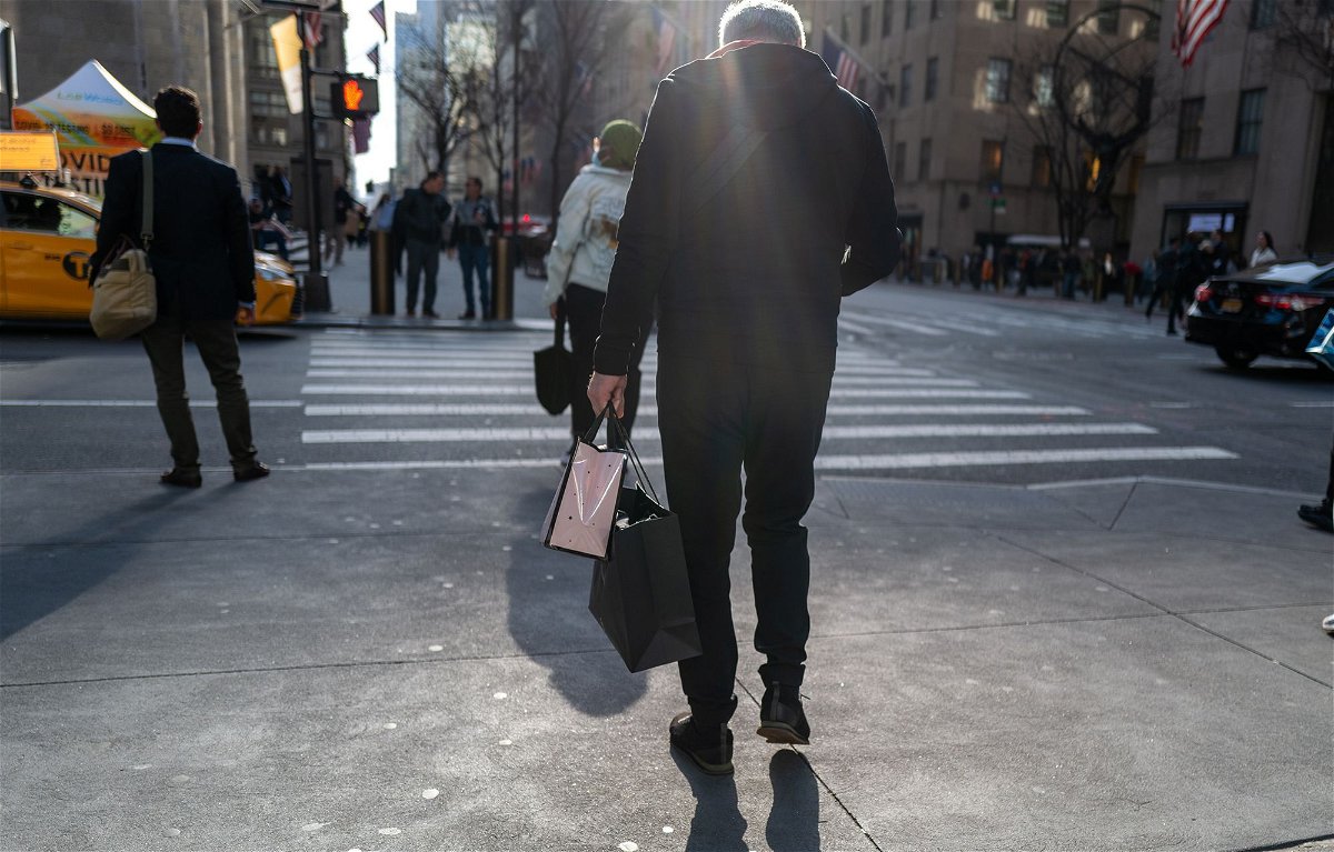<i>Spencer Platt/Getty Images</i><br/>People walk along 5th Avenue in Manhattan