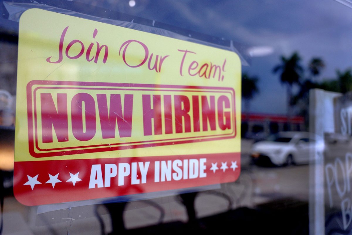 <i>Joe Raedle/Getty Images</i><br/>A 'Now Hiring' sign is seen here posted in the window of a restaurant looking to hire workers on May 5 in Miami