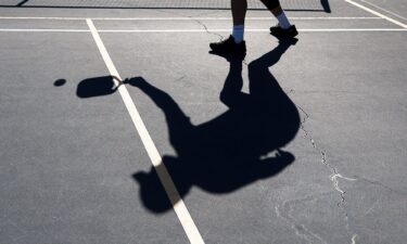 A player's shadow is seen during a game of pickleball on April 12