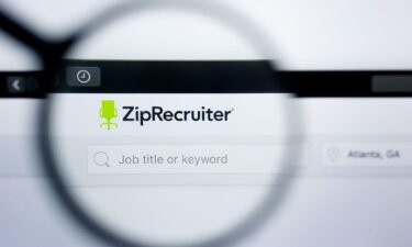 A Zip Recruiter logo is seen on a screen in Los Angeles