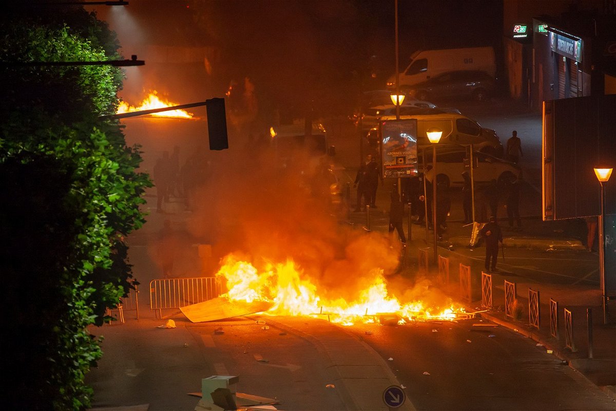 <i>Stephane Rouppert/Reuters</i><br/>Pictured here are the second night of riots following the death of Nahel