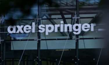 The logo of the Axel Springer publishing house is displayed above the entrance to its Berlin building on June 19.