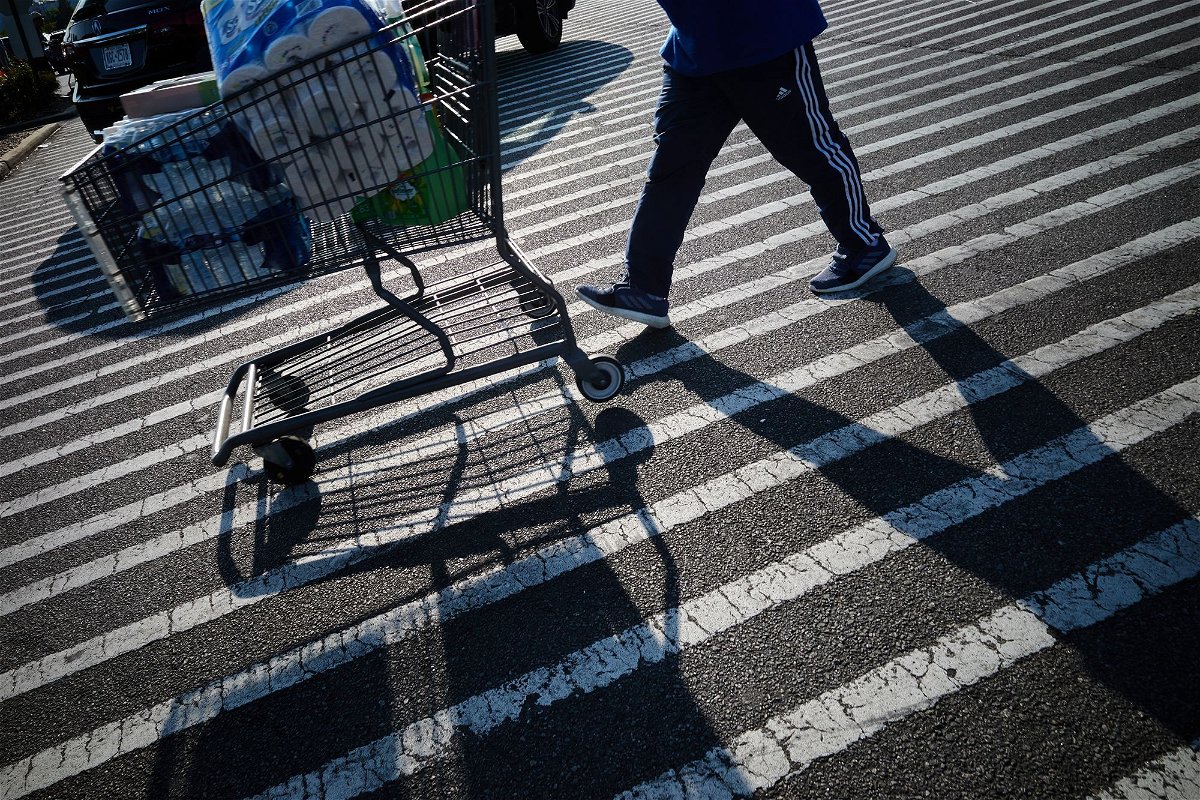 <i>Bing Guan/Bloomberg/Getty Images</i><br/>A shopper pushes a cart outside a BJ's Wholesale Club location in New York