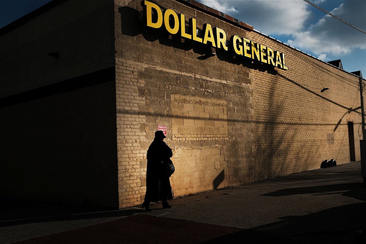 <i>Spencer Platt/Getty Images/FILE</i><br/>A woman walks by a Dollar General store on December 11