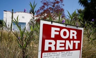 Rent is falling in America for the first time in years. A 'for rent' sign is posted in a front yard in Los Angeles