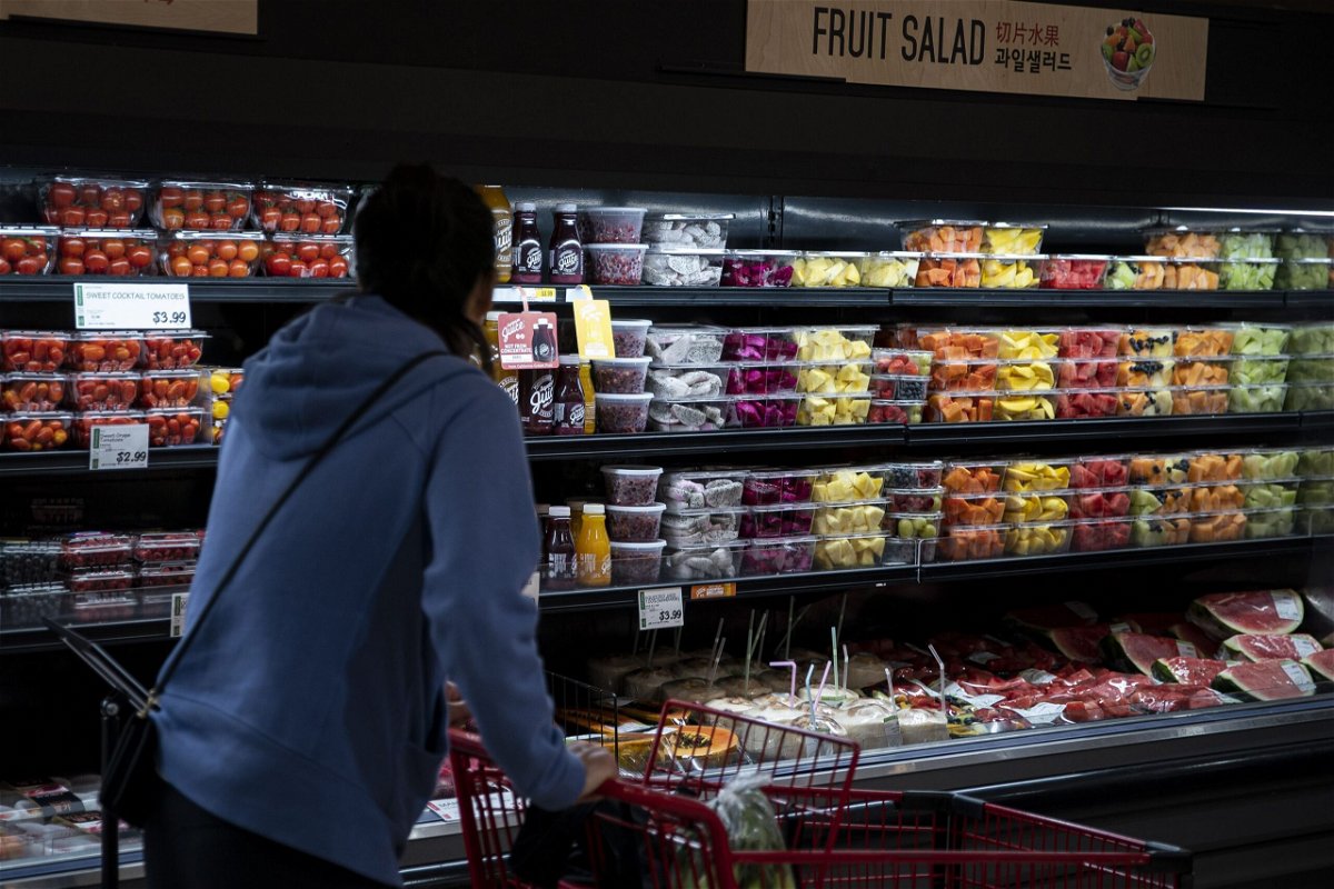 <i>Al Drago/Bloomberg/Getty Images</i><br/>A shopper is seen here near fresh fruit at a H Mart grocery store before a visit by Glenn Youngkin