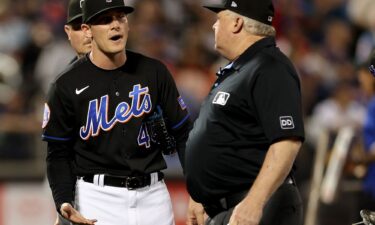 Umpire Bill Miller throws out New York Mets pitcher Drew Smith for use of a sticky substance on his hands.