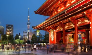 Sky tree tower with Asakusa buddhist temple in foreground evening.