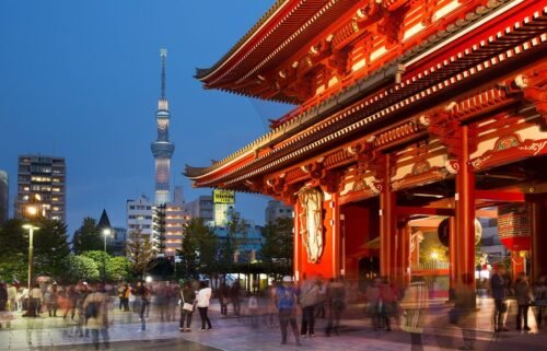 Sky tree tower with Asakusa buddhist temple in foreground evening.