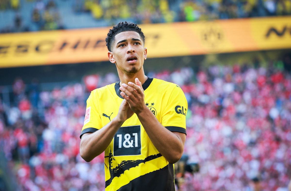 <i>Christian Charisius/dpa/picture alliance/Getty Images</i><br/>Jude Bellingham applauds the Borussia Dortmund fans after a match.